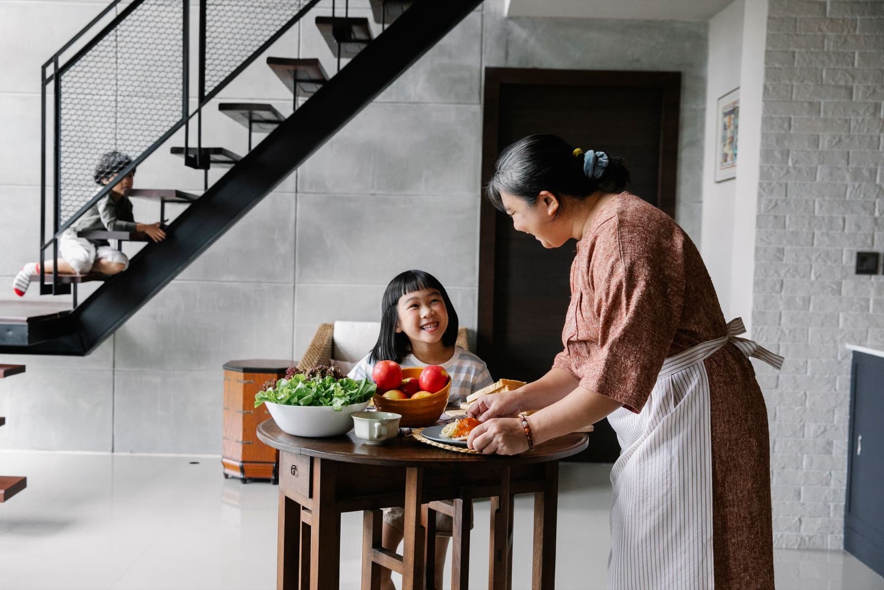 A helper preparing a family meal in a Singapore home